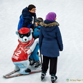 Polar bear helping this kid to ice-skate